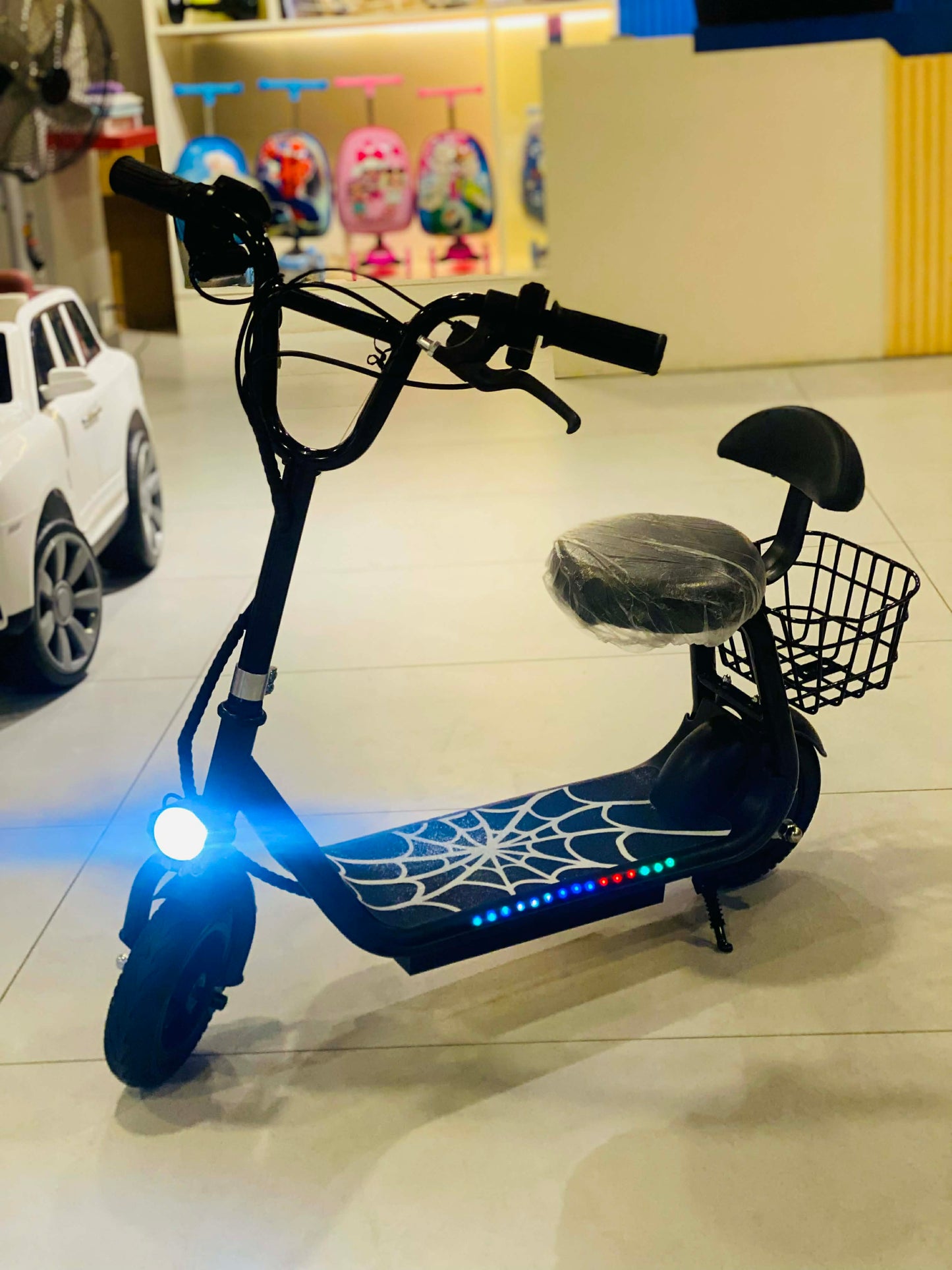 Kids Electric Scooter with Seat, LED Lights, Front Headlight & Basket – 3 Speed Modes | Rechargeable Ride-On Scooter